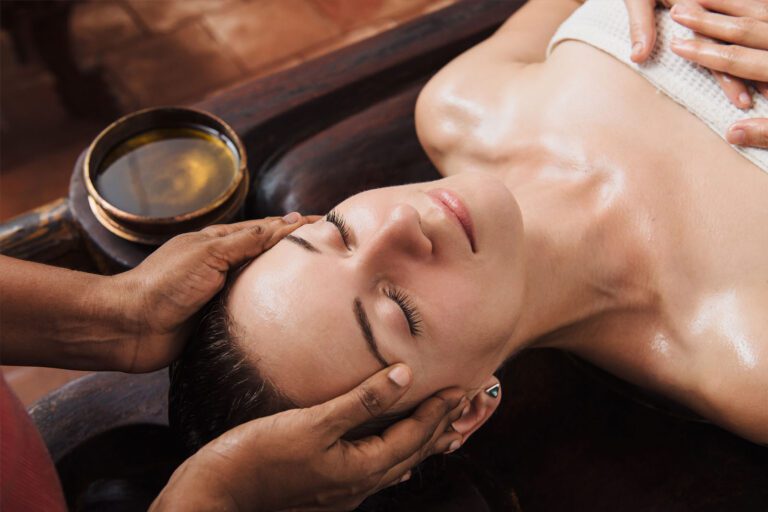 Ayurvedic practitioner with a client during a Panchakarma treatment
